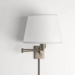 5.9 in. Hutchinson 1-Light Brushed Nickel Modern Wall Mount Swing Arm Sconce Light with White Fabric Shade by Hampton Bay 12 5.9 in. Hutchinson 1-Light Brushed Nickel Modern Wall Mount Swing Arm Sconce Light with White Fabric Shade by Hampton Bay -Hampton Bay Sales brushed nickel hampton bay wall lamps hbp609 35 a0 1000